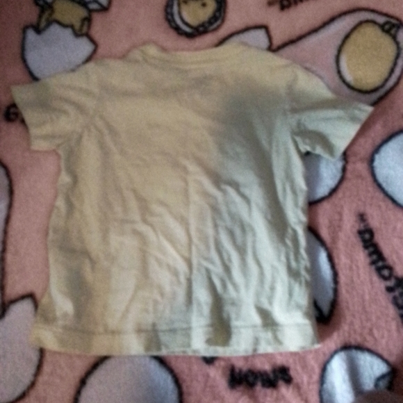 A short sleeve shirt with a sun,water,boat and car on it. - Picture 2 of 2